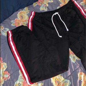 black crop joggers with red and white stripe